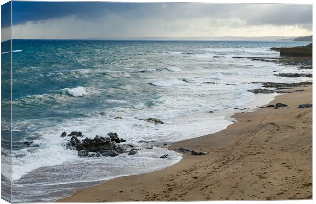 Sea Swash Around Rocks on Porthleven Beach Canvas Print by Adrian Burgess