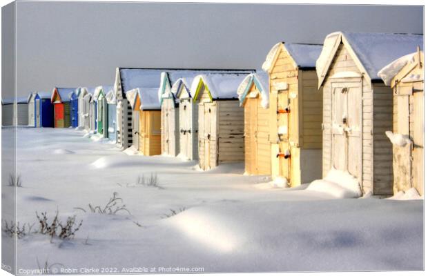 Beach Huts in Snow Canvas Print by Robin Clarke