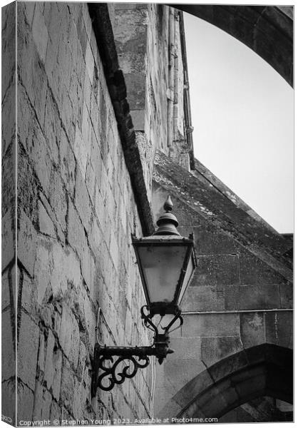 Old Lamp on Winchester Catherdral Wall Canvas Print by Stephen Young