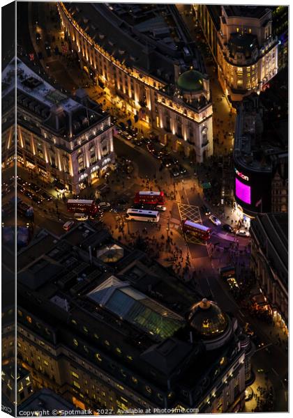 Aerial illuminated London view of Piccadilly Circus UK Canvas Print by Spotmatik 