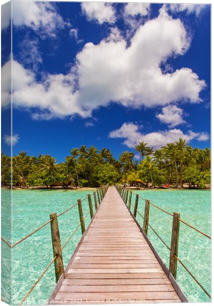 Bora Bora Island jetty in luxury tropical resort Canvas Print by Spotmatik 