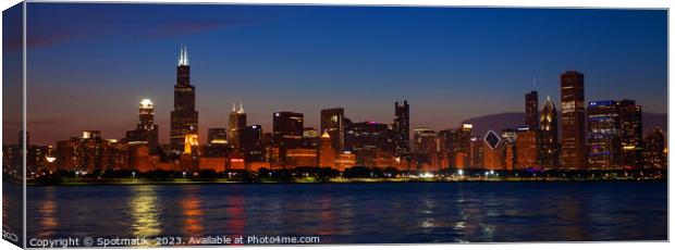 Panorama of Chicago city skyscrapers illuminated at dusk Canvas Print by Spotmatik 