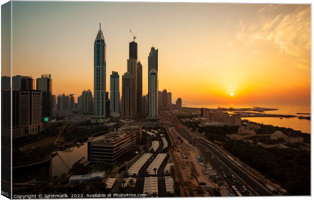 Dubai sunset Sheikh Zayed Road Media city skyscrapers  Canvas Print by Spotmatik 