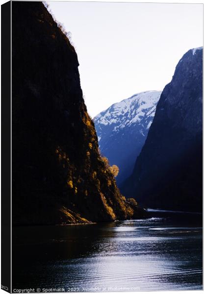 View Norwegian scenic fjord steep cliffs majestic mountains Canvas Print by Spotmatik 