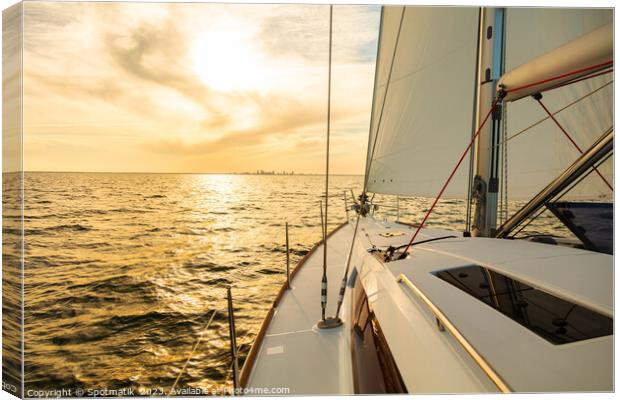 Sailing private yacht towards city skyline at sunrise Canvas Print by Spotmatik 