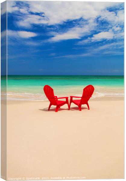Tranquil holiday destination with red chairs on beach Canvas Print by Spotmatik 