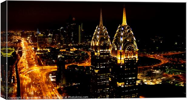 Aerial illuminated Downtown night view of Dubai UAE Canvas Print by Spotmatik 