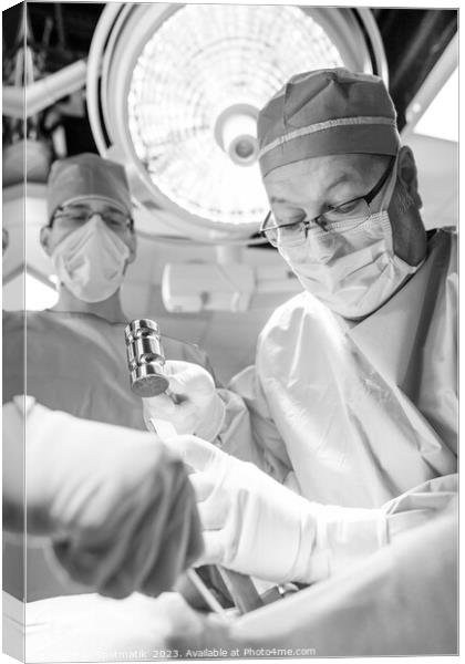 Surgeon operating on patient Hospital Research Canvas Print by Spotmatik 
