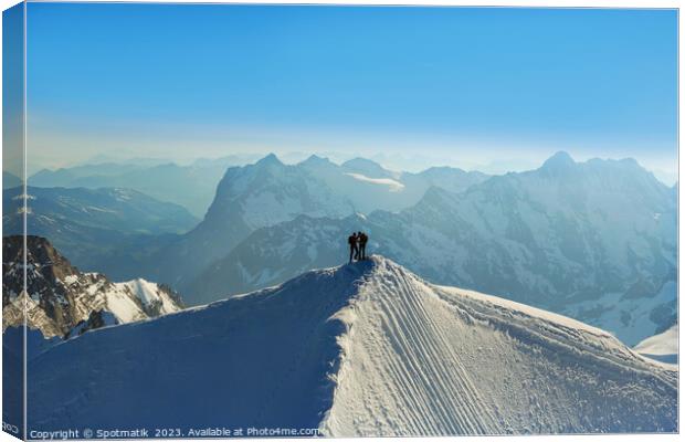 Aerial Switzerland two climbers on mountain summit Europe Canvas Print by Spotmatik 