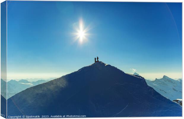 Aerial view Switzerland climbers on mountain summi Canvas Print by Spotmatik 