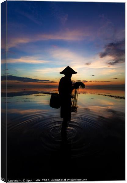 Sunrise Balinese male net fishing Flores sea coastline  Canvas Print by Spotmatik 