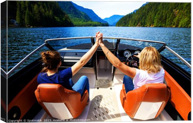 Vancouver Caucasian females out celebrating in powerboat Canada Canvas Print by Spotmatik 