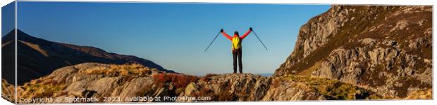 Panoramic happy female backpacker nearing mountain summit Canvas Print by Spotmatik 