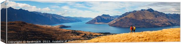 Panorama of backpacking couple spending vacation hiking outdoors Canvas Print by Spotmatik 