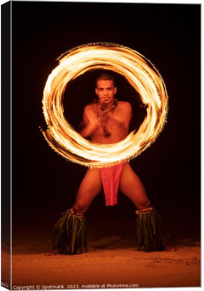 French Polynesia Illuminated flaming torch male Fire dancer  Canvas Print by Spotmatik 