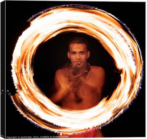 Male Polynesian Fire dancer performing Ring of Fire  Canvas Print by Spotmatik 