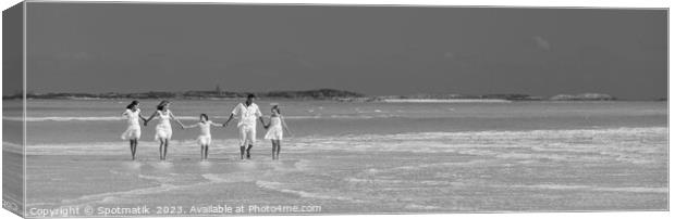 Panorama of mother father with family walking on beach  Canvas Print by Spotmatik 