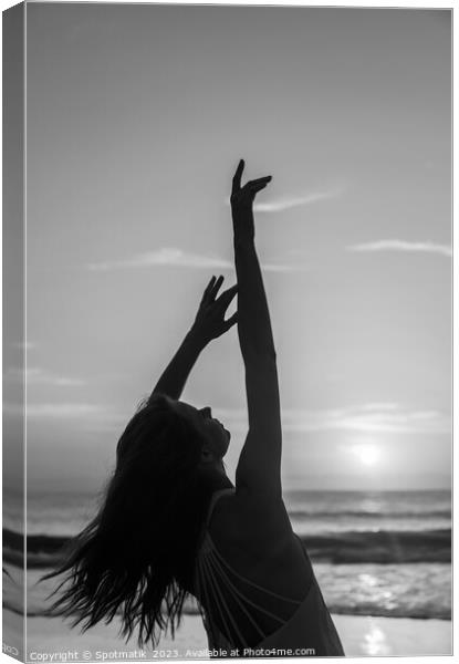 Bohemian girl enjoying carefree lifestyle dancing on beach Canvas Print by Spotmatik 