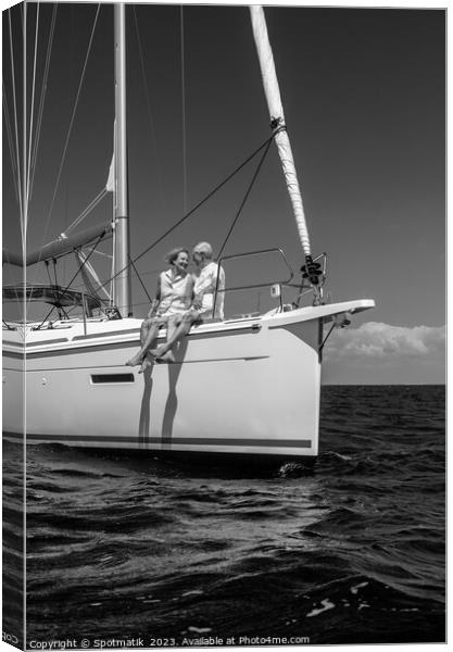 Loving retired couple relaxing together on luxury yacht Canvas Print by Spotmatik 