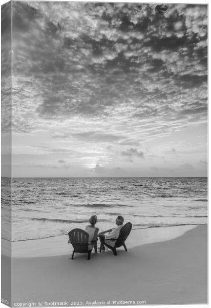 Retired Caucasian couple on beach at sunset Bahamas Canvas Print by Spotmatik 