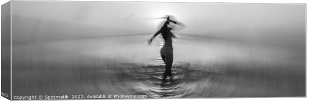 Panoramic ocean sunset with dancing girl motion blur Canvas Print by Spotmatik 