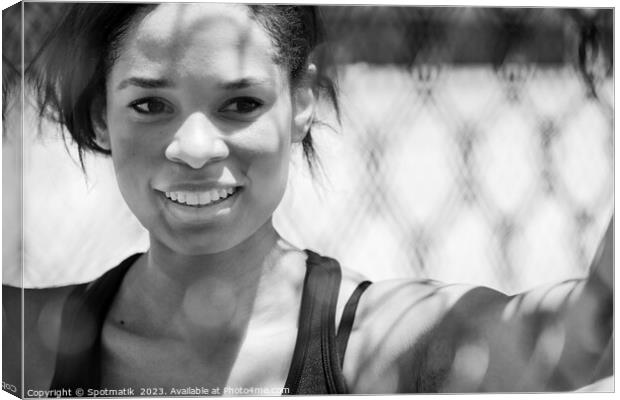 Afro American female smiling after healthy outdoor exercise Canvas Print by Spotmatik 