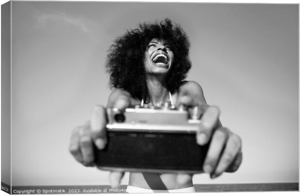 Laughing Afro American girl taking selfie on beach Canvas Print by Spotmatik 