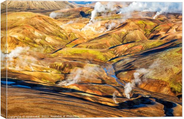 Aerial natural steam rising from steam fissures Landmannalaugar  Canvas Print by Spotmatik 
