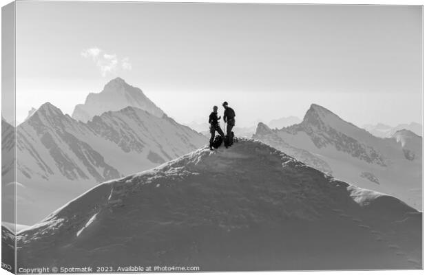 Aerial Switzerland two climbers on snow covered Peak Canvas Print by Spotmatik 