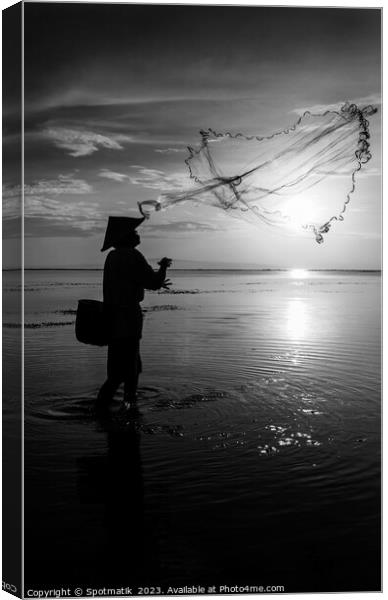 Indian ocean Balinese fisherman at sunrise fishing Indonesia Canvas Print by Spotmatik 