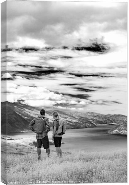 New Zealand Male female hikers trekking The Remarkables Canvas Print by Spotmatik 