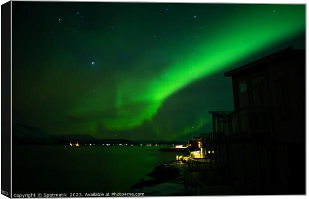 Northern Lights display in sky Arctic Circle Norway Canvas Print by Spotmatik 