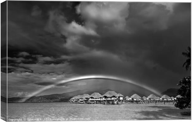 Rain shower creating Multicolored rainbow Bora Bora Resort Canvas Print by Spotmatik 