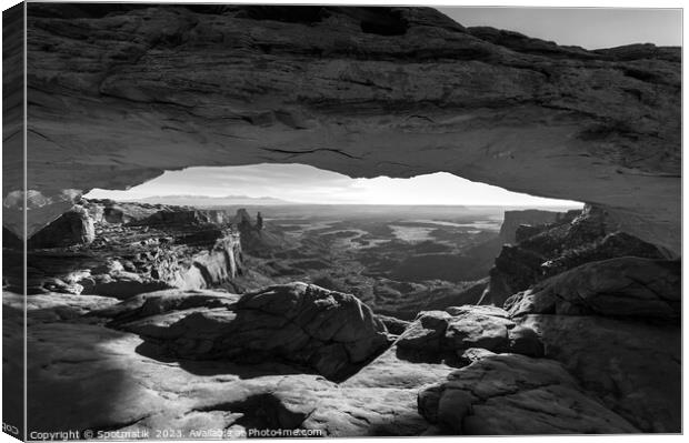 View of the rising sun Mesa sandstone Arch  Canvas Print by Spotmatik 