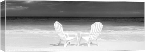 Panoramic white chairs on beach beside ocean Canvas Print by Spotmatik 