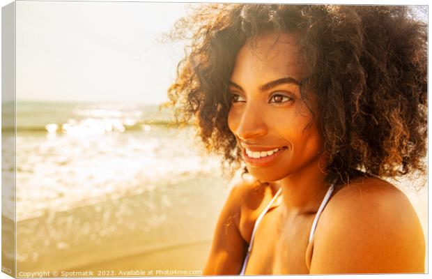 Smiling Afro American female enjoying Summer by Ocean Canvas Print by Spotmatik 