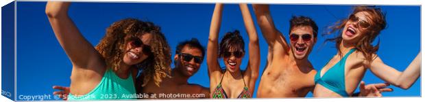 Panoramic view of friends having fun on beach Canvas Print by Spotmatik 