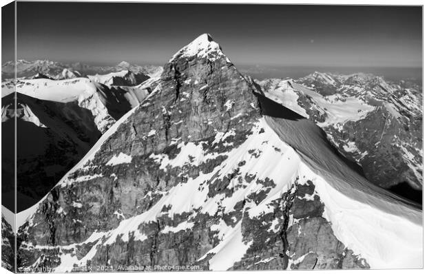 Aerial view of Switzerland mountain Peak cliff face Canvas Print by Spotmatik 