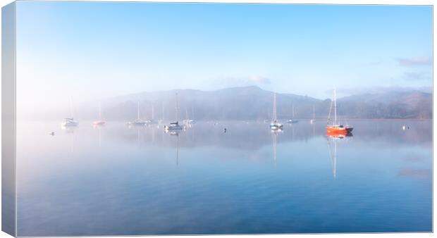 Sailing Boats on Windermere on a winters morning with mist and sun glow Canvas Print by Julian Carnell