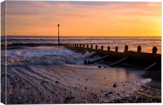 Sunrise over Withernsea beach Canvas Print by Tim Hill
