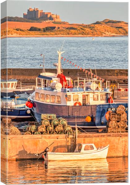 Majestic Bamburgh Castle at Sunrise Canvas Print by Tim Hill