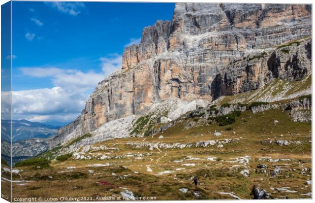 Male mountain climber on a Via Ferrata in breathtaking landscape of Dolomites Mountains in Italy. Travel adventure concept. Canvas Print by Lubos Chlubny