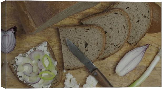 Home made bread on a wooden cutting board with curd cheese Canvas Print by Irena Chlubna