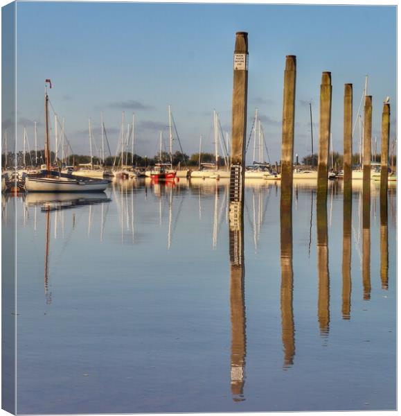 Mooring posts at the Brightlingsea hard.  Canvas Print by Tony lopez