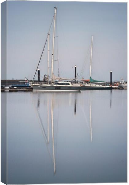 Morning calm over Brightlingsea Harbour with great reflections  Canvas Print by Tony lopez