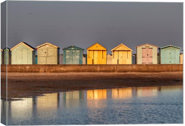 Beach huts basking in a Brightlingsea  Sunset  Canvas Print by Tony lopez