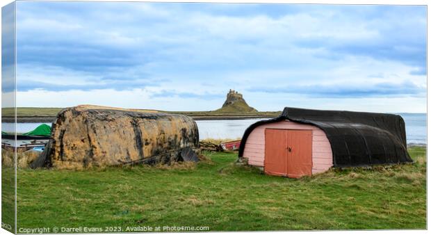 Lindisfarne Huts and Castle Canvas Print by Darrell Evans
