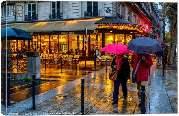 Paris in the rain Canvas Print by Chris Mann