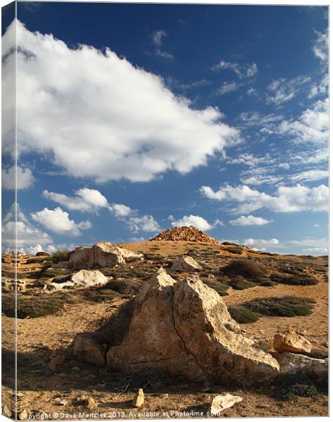 Rocks and Sky Canvas Print by Dave Menzies