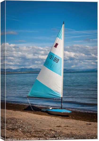 Sailboat at Llanbedrog Beach Canvas Print by David Macdiarmid